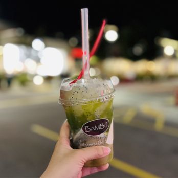 BAMBU - a hand holding a cup of iced coffee - Juice Bars & Smoothies Near Me - Madison, Wisconsin