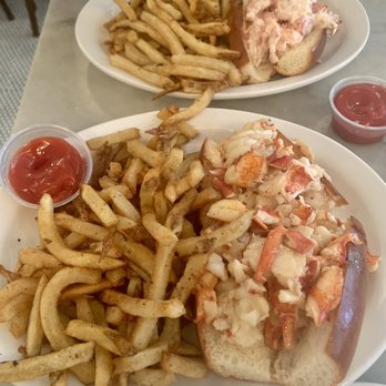 Neptune Oyster - Maine Lobster Roll Sandwich - hot (front) and cold (back) Hot cold: the warm butter carries the flavor better - Seafood Near Me - Boston, Massachusetts Neptune Oyster - Maine Lobster Roll Sandwich - hot (front) and cold (back) Hot cold: the warm butter carries the flavor better - Seafood Near Me - Boston, Massachusetts