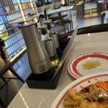Mikaku Ramen & Temaki - Soy sauce and sauces at the table - Ramen Near Me - Aurora, Colorado