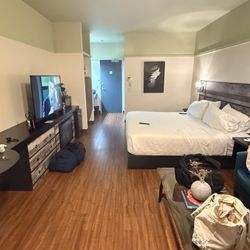 Samuels Hotel - Sorry about all our stuff, but a king-size bed, 2 comfortable chairs, etc.