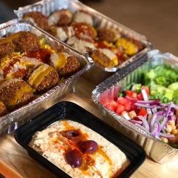Halal Time - a variety of food items on a table - Food Trucks Near Me - Austin, Texas