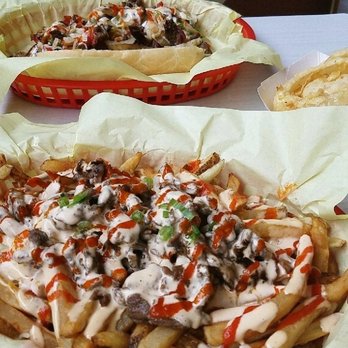 Bumblebees BBQ and Grill - K-POP fries and the Bul-gogi gogi sandwich in the back. (Side of onion rings slightly hiding to the side) - New American Near Me - Midvale, Utah Bumblebees BBQ and Grill - K-POP fries and the Bul-gogi gogi sandwich in the back. (Side of onion rings slightly hiding to the side) - New American Near Me - Midvale, Utah