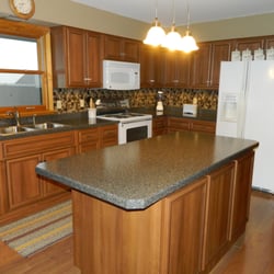 Steinhour Construction - Hazelnut Formica vintage / with black glaze cabinets , Beveled Edge Formica counter tops , tiled backsplashes, under cabinet ...