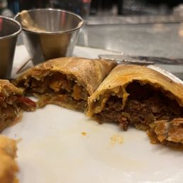 Close up of Chorizo empanada (right) and veggie empanada Close up of Chorizo empanada (right) and veggie empanada