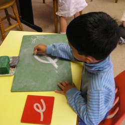 Learning to write the Montessori way.