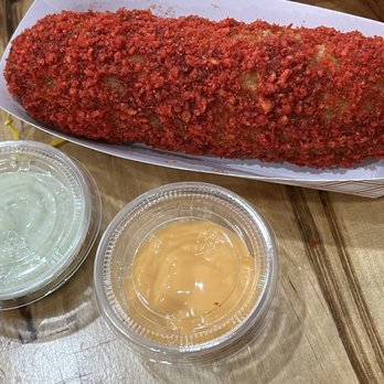 Oh K-Dog Forest Hills - Hot Cheetos Dog -liked it with the mexican chili mayo sauce; not so much with the cheesy garlic sauce - Hot Dogs Near Me - Forest Hills, New York