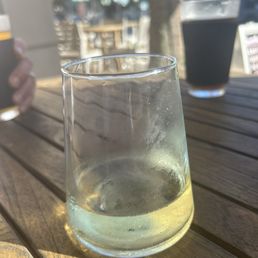 Delicious glass of wine while friends were enjoying beer