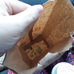  a person holding a bag of food