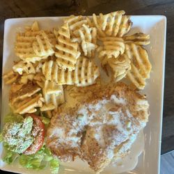 The Bistro at Blanco River - Fried Chicken breast with cheese sauce and waffle fries.