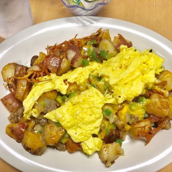 Eggs Up Grill - Sausage & cheese home fry platter gives life to hangovers. - Breakfast & Brunch Near Me - Conway, South Carolina Eggs Up Grill - Sausage & cheese home fry platter gives life to hangovers. - Breakfast & Brunch Near Me - Conway, South Carolina