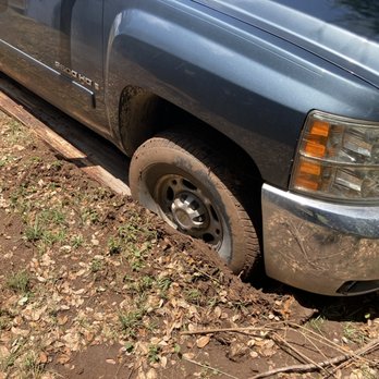J-A Towing Service - This was much worse than the picture shows. Both tires sunk to the axles in wet mud. - Roadside Assistance Near Me - Austin, Texas J-A Towing Service - This was much worse than the picture shows. Both tires sunk to the axles in wet mud. - Roadside Assistance Near Me - Austin, Texas