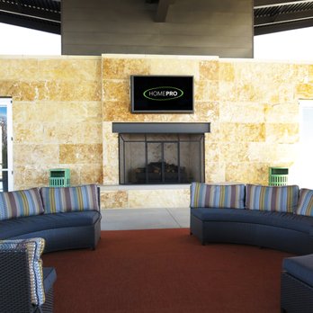 Homepro Mounted Tv Over Fireplace At Neighborhood Outdoor Patio In