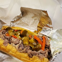 Beef sausage combination sandwich with hot peppers. Beef sausage combination sandwich with hot peppers.