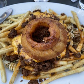 The Gate House - Plate topped with two perfect onion rings - Burgers Near Me - Rochester, New York The Gate House - Plate topped with two perfect onion rings - Burgers Near Me - Rochester, New York