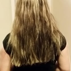 Upper Cuts Styling & Tanning Salon - The uneven slant she cut into my hair