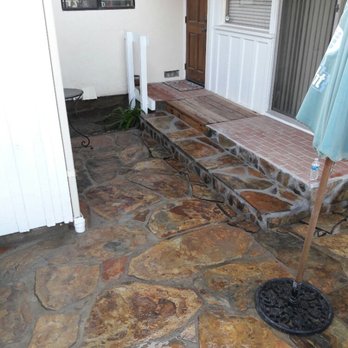 Bello's Landscaping - Big horn natural stone patio with a small red wood bridge and stone stairs we build in Encinitas - Landscaping Near Me - Vista, California