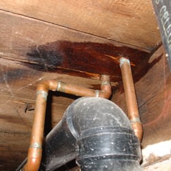 Land Made - Evidence in the basement of a water leak from inside an upstairs wall.