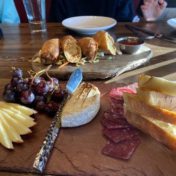The Firebrand Restaurant - Some of the happy hour food. Brie plate and spring rolls. - Lounges Near Me - Whitefish, Montana The Firebrand Restaurant - Some of the happy hour food. Brie plate and spring rolls. - Lounges Near Me - Whitefish, Montana