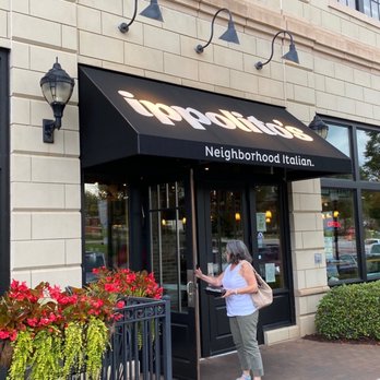 Ippolito's - a woman standing outside of a restaurant - Italian Near Me - Suwanee, Georgia Ippolito's - a woman standing outside of a restaurant - Italian Near Me - Suwanee, Georgia