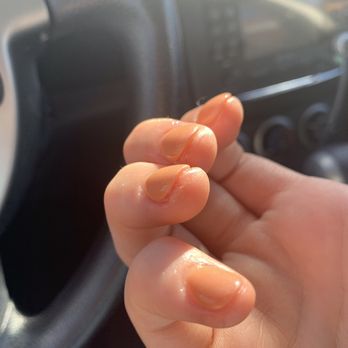 702 Nail Lounge - Hard to capture in a photo but underneath the nail of my ring finger is a section of cured on gel top coat - Nail Salons Near Me - Henderson, Nevada
