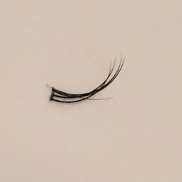 Extensions should not be like this. A clump of lashes glued together on my lash line. You can see my natural lash in the middle. Extensions should not be like this. A clump of lashes glued together on my lash line. You can see my natural lash in the middle.