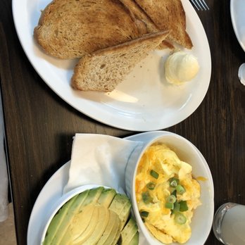 Le Petit Belge - A few sides: two eggs, 1/2 avocado, wheat toast and decaf latte. Yum! - Breakfast & Brunch Near Me - Vancouver, British Columbia
