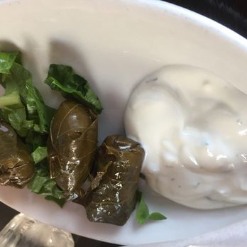 Troy Greek Cuisine - Dolmas with a garnish of tzatziki - Greek Near Me - Berkeley, California Troy Greek Cuisine - Dolmas with a garnish of tzatziki - Greek Near Me - Berkeley, California