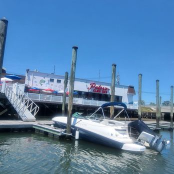 Peter's Clam Bar - View of the restaurant as you approach by boat - Seafood Near Me - Island Park, New York Peter's Clam Bar - View of the restaurant as you approach by boat - Seafood Near Me - Island Park, New York