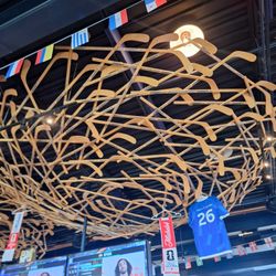 La Cage aux Sports - Hockey stick decoration