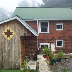 A Cottage at Campbell Farm - View driving in and entrance (from driveway) area of cottage.