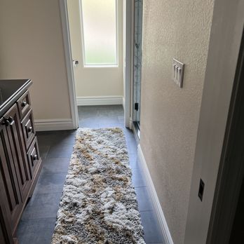 Fabian Renovation - Bathroom flooring, new toilet, repainted and fixed the pocket door. - General Contractors Near Me