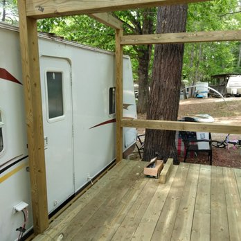 Renaissance Men - a wooden deck with a camper in the background - Roofing Near Me - Princeton, West Virginia