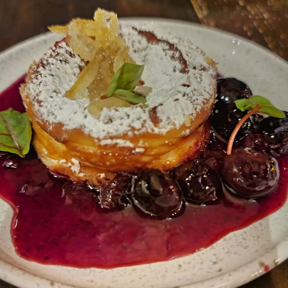 La Bodega - Basque cheesecake with candied lemon peel on top - Spanish Near Me - Watertown, Massachusetts