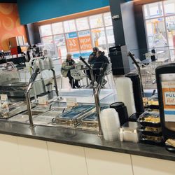 Hot food bar: pizza slices, soup, nachos, wings and more!