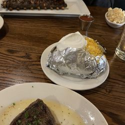 Wyoming's Rib & Chop House - Petite filet, huge baked potato... half rack of ribs and Mac n cheese.