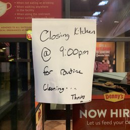 a sign in the window of a restaurant a sign in the window of a restaurant