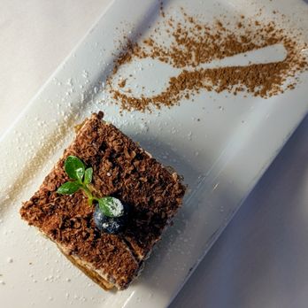 Oliver's Osteria - Tiramisú: Layered espresso-soaked cake, mascarpone cream, cacao - Italian Near Me - Laguna Beach, California Oliver's Osteria - Tiramisú: Layered espresso-soaked cake, mascarpone cream, cacao - Italian Near Me - Laguna Beach, California