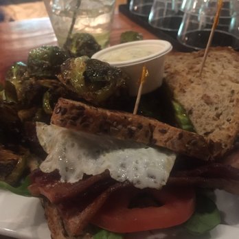 Taproot Lounge & Cafe - Bacon sandwich, with egg, avocado and a side of Brussels sprouts. - Lounges Near Me - Salem, Oregon Taproot Lounge & Cafe - Bacon sandwich, with egg, avocado and a side of Brussels sprouts. - Lounges Near Me - Salem, Oregon
