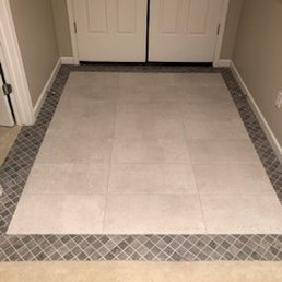 Entry Way 12x24 surrounded by mosiac tile Entry Way 12x24 surrounded by mosiac tile