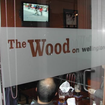 The Wood on Wellington - a man sitting at a table - Sports Bars Near Me - Ottawa, Ontario The Wood on Wellington - a man sitting at a table - Sports Bars Near Me - Ottawa, Ontario