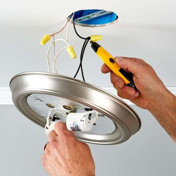 KDG Handyman Services - a man fixing a light fixture - Handyman Near Me KDG Handyman Services - a man fixing a light fixture - Handyman Near Me