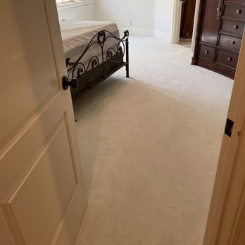Outlook Flooring - a bedroom with a bed and dresser - Carpet Installation Near Me - Monroe, North Carolina Outlook Flooring - a bedroom with a bed and dresser - Carpet Installation Near Me - Monroe, North Carolina