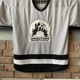 a hockey jersey hanging on a brick wall a hockey jersey hanging on a brick wall