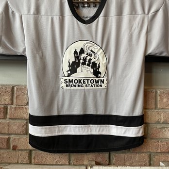 Smoketown Brewing Station - a hockey jersey hanging on a brick wall - Breweries Near Me - Brunswick, Maryland Smoketown Brewing Station - a hockey jersey hanging on a brick wall - Breweries Near Me - Brunswick, Maryland