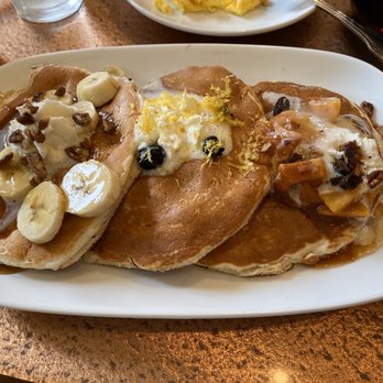 Another Broken Egg Cafe - Pancake Trio: Bananas Foster, Lemon Blueberry, Peach Cobbler - Breakfast & Brunch Near Me - Ridgeland, Mississippi Another Broken Egg Cafe - Pancake Trio: Bananas Foster, Lemon Blueberry, Peach Cobbler - Breakfast & Brunch Near Me - Ridgeland, Mississippi