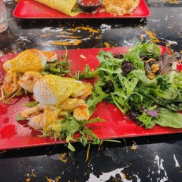Seafood Benedict with salad