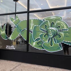 Mario’s Pizzeria of Levittown - Beautiful green blue design bow in window done by Mike the artist