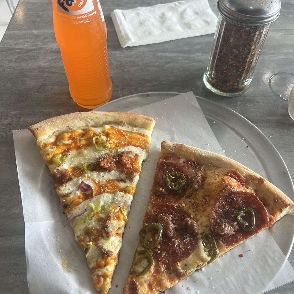 The Pizza Joint - Buffalo chicken pizza and a pepperoni, sausage and jalapeño pizza slice. - Pizza Near Me - San Diego, California The Pizza Joint - Buffalo chicken pizza and a pepperoni, sausage and jalapeño pizza slice. - Pizza Near Me - San Diego, California