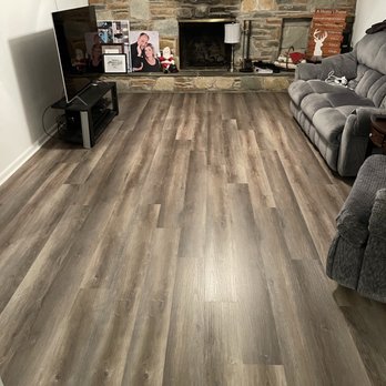 Floors By Napoli - a living room with a stone fireplace - Flooring Near Me - Croydon, Pennsylvania Floors By Napoli - a living room with a stone fireplace - Flooring Near Me - Croydon, Pennsylvania