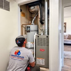 Prestigious Heating & Air Conditioning - Our technician installing a Bryant furnace and indoor AC coil in a furnace closet in Encinitas, CA.
